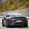 The rear of A black Porsche 911 Carrera GTS 2022 sport car