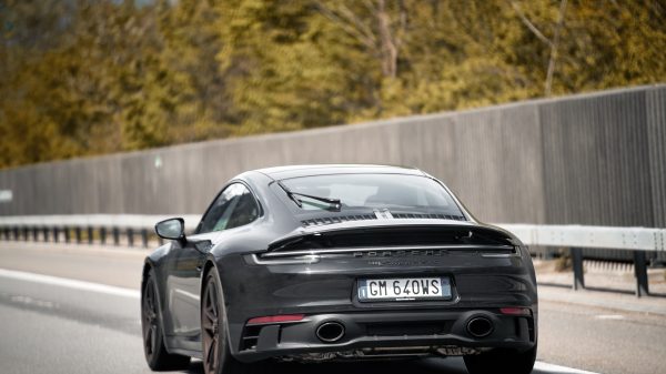 The rear of A black Porsche 911 Carrera GTS 2022 sport car