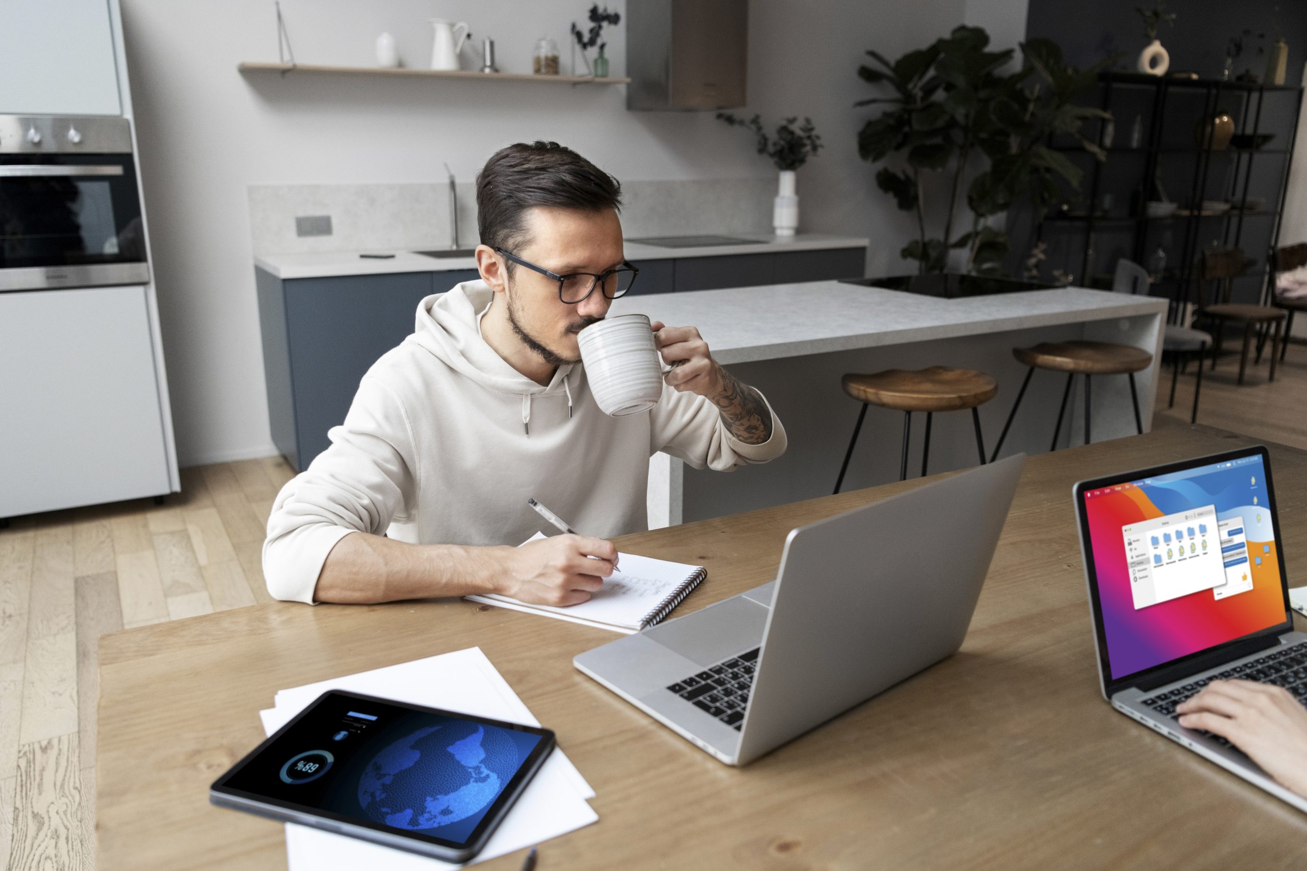 avatar Man working from home at desk while having a drink
