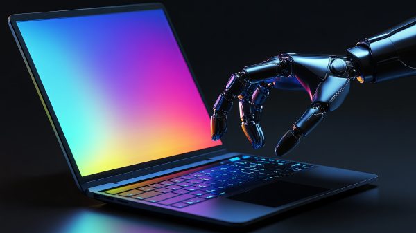 A robotic hand reaches out to a laptop with a colorful gradient screen