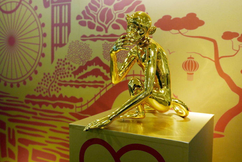 Gold-colored sculpture.